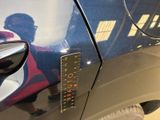 a sticker on the door of a car that says to turn on