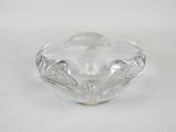 clear glass ashtray with a decorative design on a white background