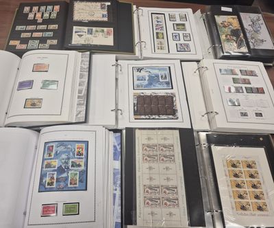 many different types of stamps on the pages of a book