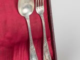 a case with silverware in it on a table