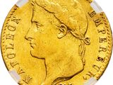 gros plan d'une pièce d'or sur fond blanc