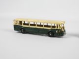 a toy bus that is sitting next to a toy car