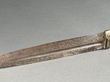 a knife that is sitting on top of a table