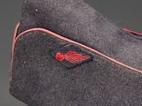 grey wool cap with red stitching on the side of the hat