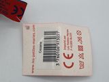 a tag on a white table with a red and black tag on it