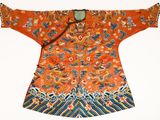 an orange and blue jacket with a floral design on it