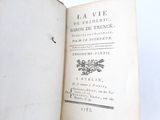 an open book with a picture of flowers on it
