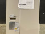 a machine that has a lot of papers on top of it