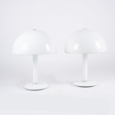 pair of white table lamps in the style of person
