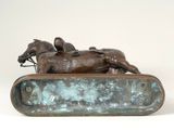 statue of a horse and rider on a bronze base on a white background