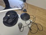 a lot of headphones that are sitting on a table