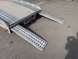 an image of a flatbed trailer parked in a parking lot