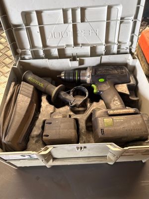 a box with tools in it sitting on the floor