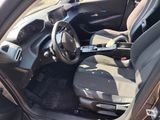 the interior of a car with a steering wheel and a seat belt