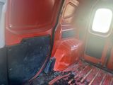 an image of a red van with the door open