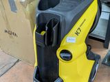 the yellow and black pressurer is sitting on the floor next to boxes