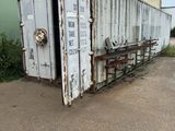 a large white container sitting in the middle of a parking lot