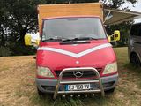 a red van that is parked in the grass