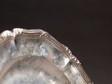 a silver plate that is sitting on a table