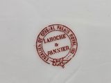 a close up of a plate with a logo on it