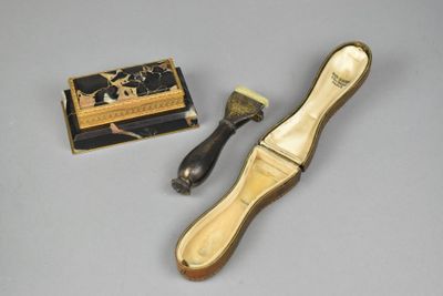 a small brush and a box on a table