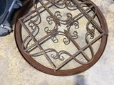 a person standing in front of a manhole on the floor
