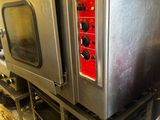 an image of a commercial kitchen with stainless steel appliances