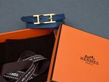 an orange box with a black belt and a blue belt