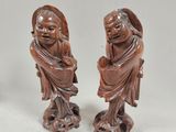 pair of chinese carved figurines of a man and a woman