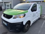 a picture of a van parked in front of a building