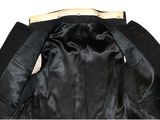 the back of a black leather jacket with a white collar