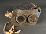 an old pair of binoculars sitting on top of a table