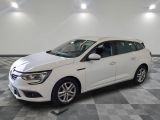 the white car is parked on a checkered floor in the garage