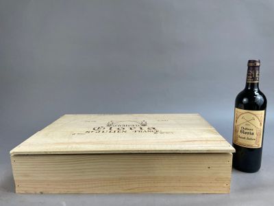 a wooden box with a bottle of wine next to it
