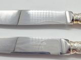 two knives that are sitting next to each other
