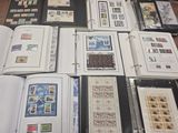 many different types of stamps on the pages of a book