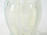 a glass vase that is sitting on a table