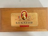 an image of a wooden box with a picture of a man in a suit on it
