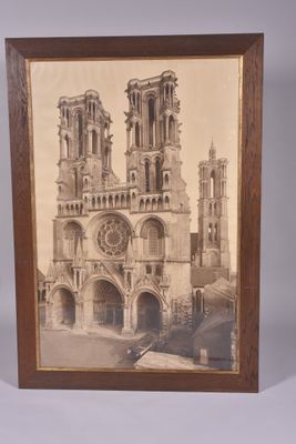 an old picture of a cathedral with a clock on the front