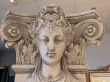 a statue of a woman with a crown on it ' s head