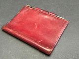 leather wallet with a metal clasp on the front of it