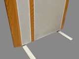 a close up of a wooden panel with a speaker on it