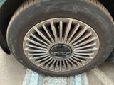 a close up of a tire on a car ' s rim