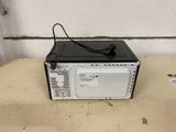 a black and white microwave sitting on a table
