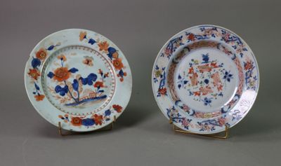 pair of chinese porcelain plates with flowers and birds on them