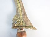 a wooden object that is hanging on the wall