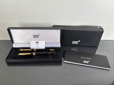 an image of a black box with a pen and a notepad in it