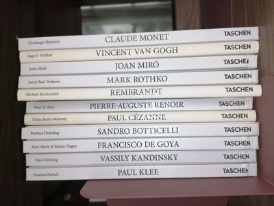 many books stacked on top of each other on a shelf