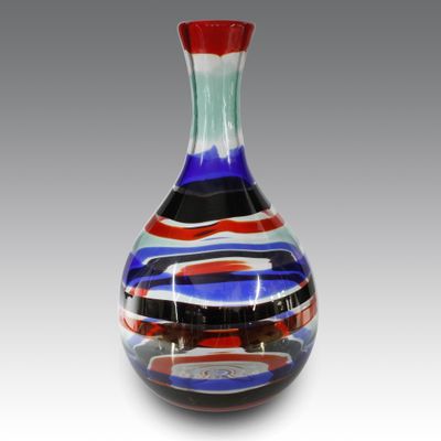 a glass vase with a red, white, and blue design on it