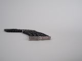 black beaded bracelet with a silver clasp on a white background